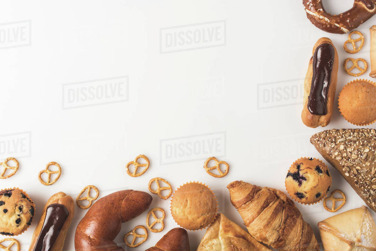 Top view of arranged sweet bakery isolated on white Stock Photo