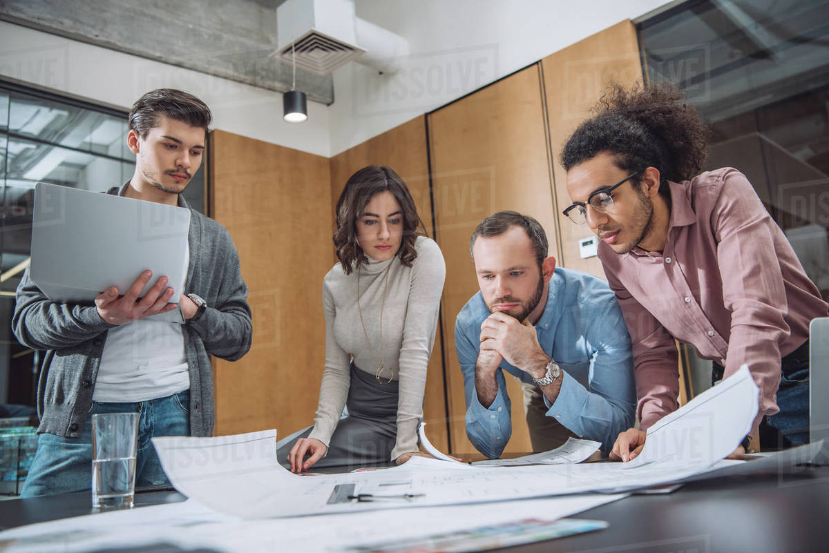 Group of thoughtful architects working together at office Royalty-free stock photo