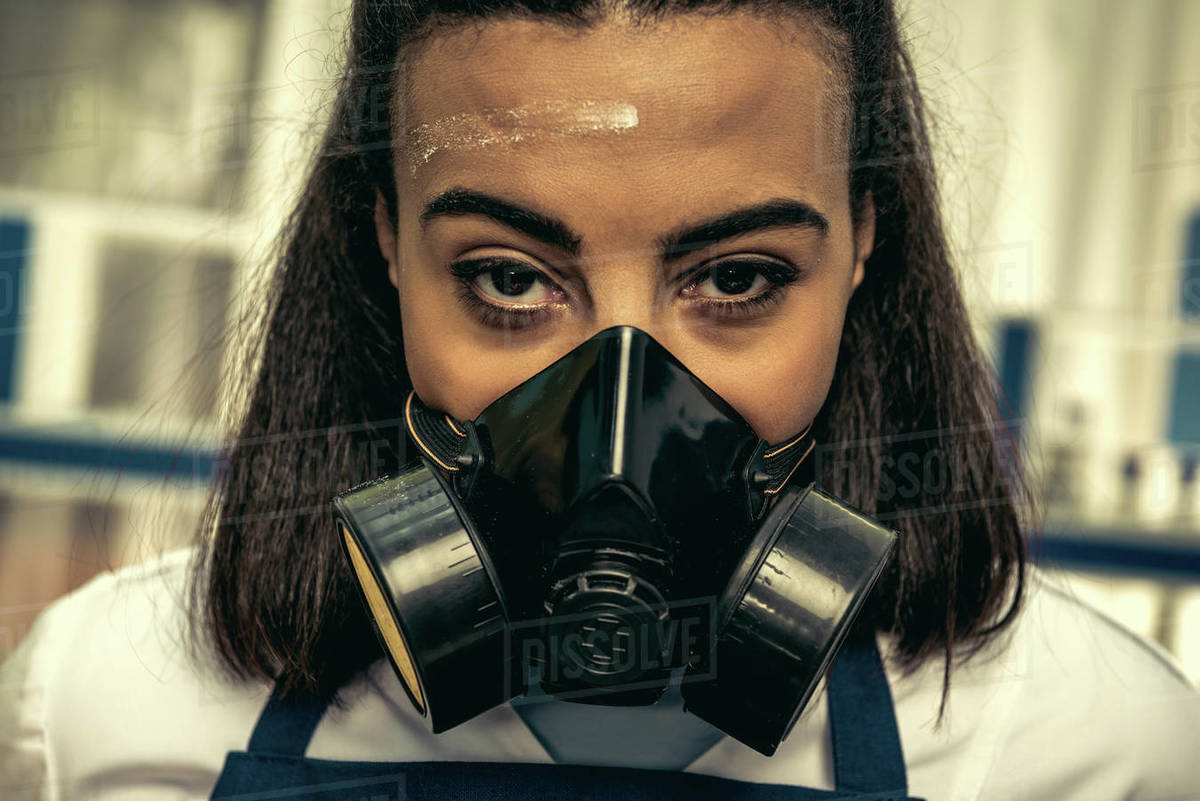 young girl laboratory technician in personal protective equipment