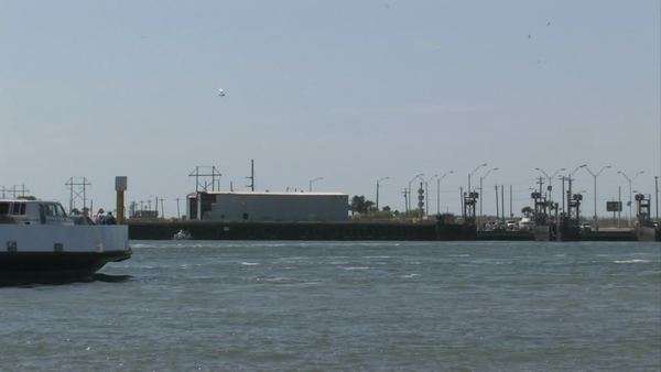 ferry leaving dock at port aransas texas turning around a small island boat works port aransas tx