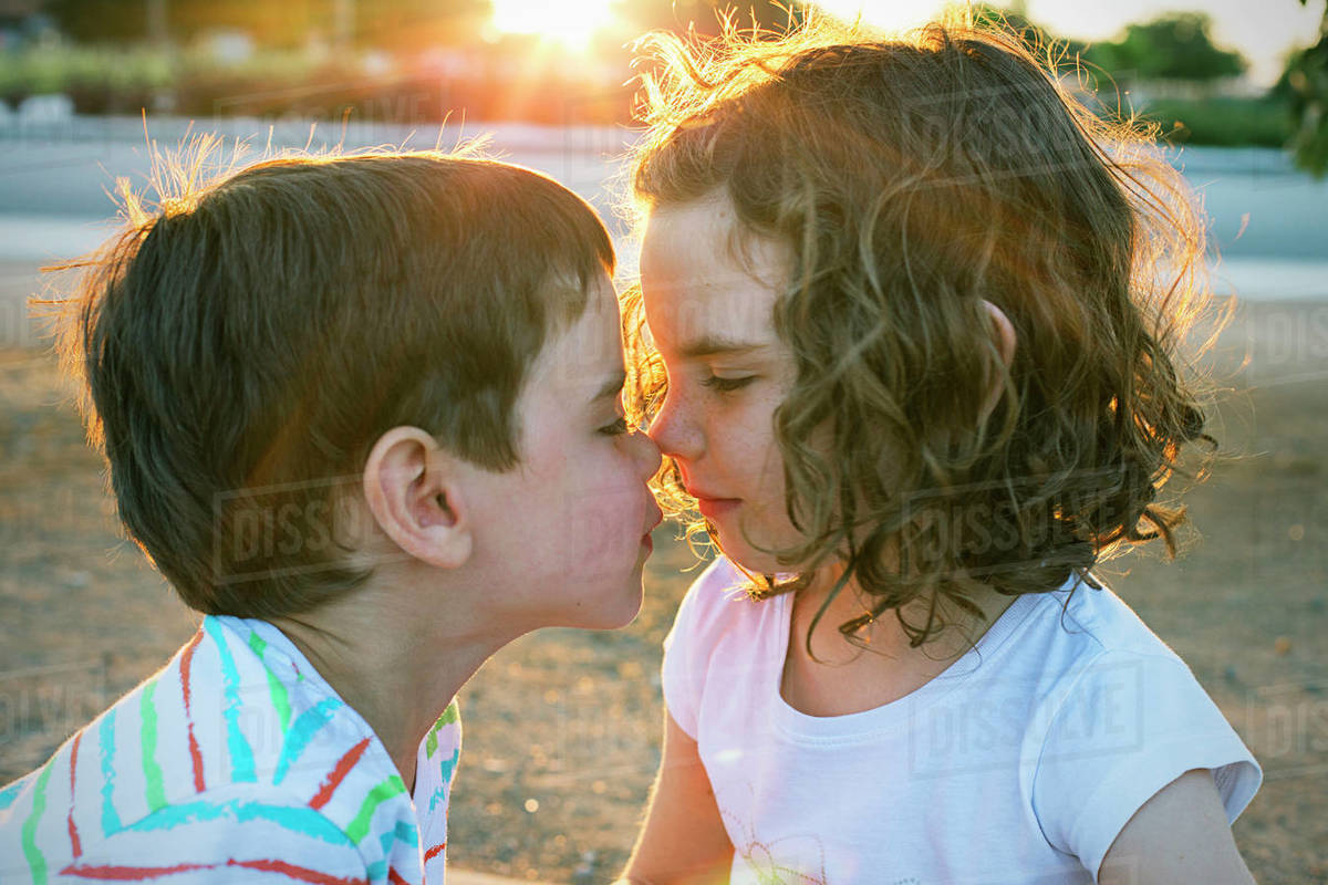 Two children rubbing noses Stock Photo Dissolve