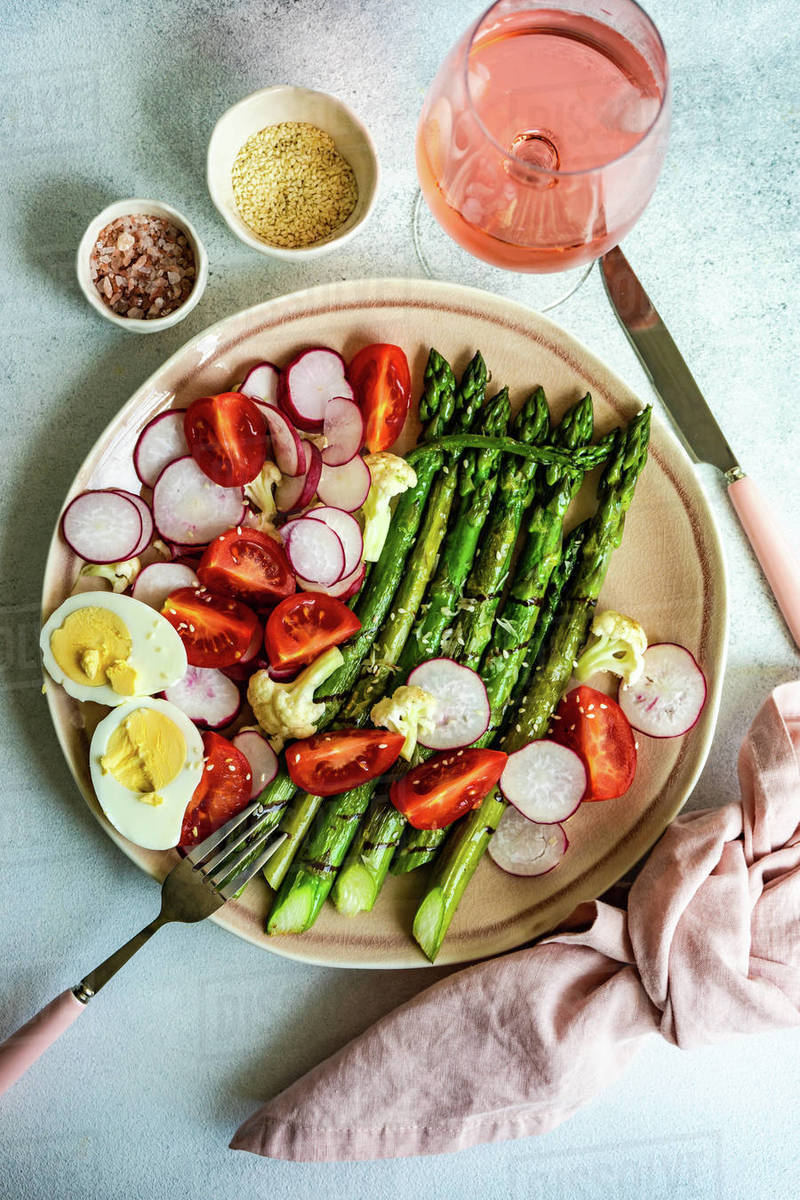 Roasted asparagus with parmesan, hard boiled egg, cherry tomatoes