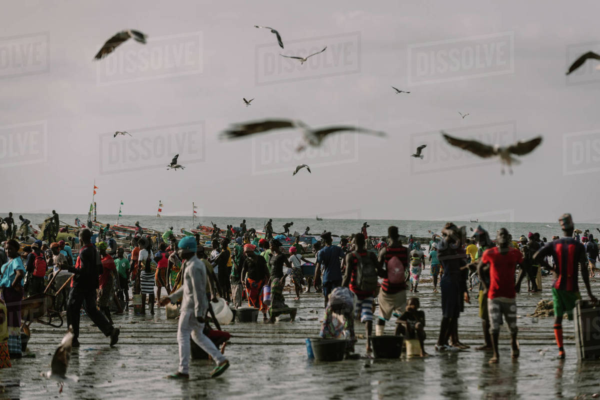 Gambia, Africa August 3, 2019 Crowded beach of Atlantic shore during