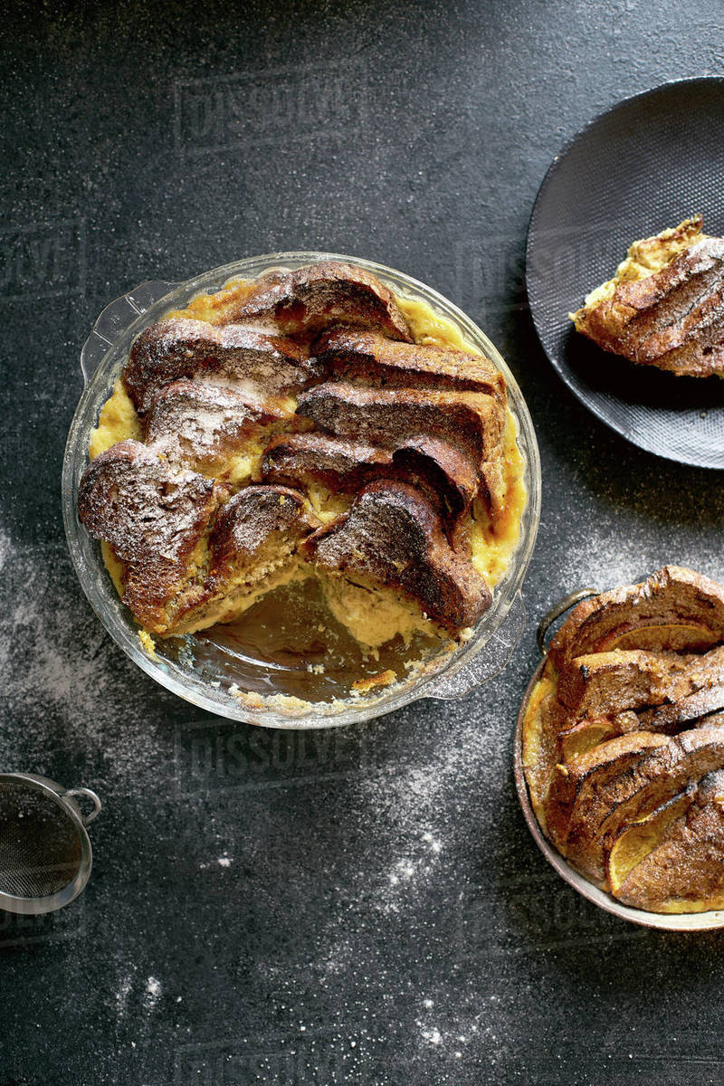 Top view of traditional bread pudding with custard, served with