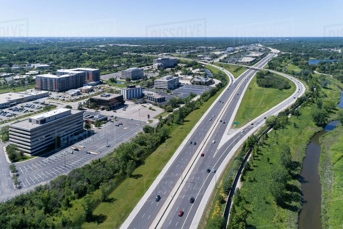 Aerial view of a highways, overpasses, ramps and buildings in a