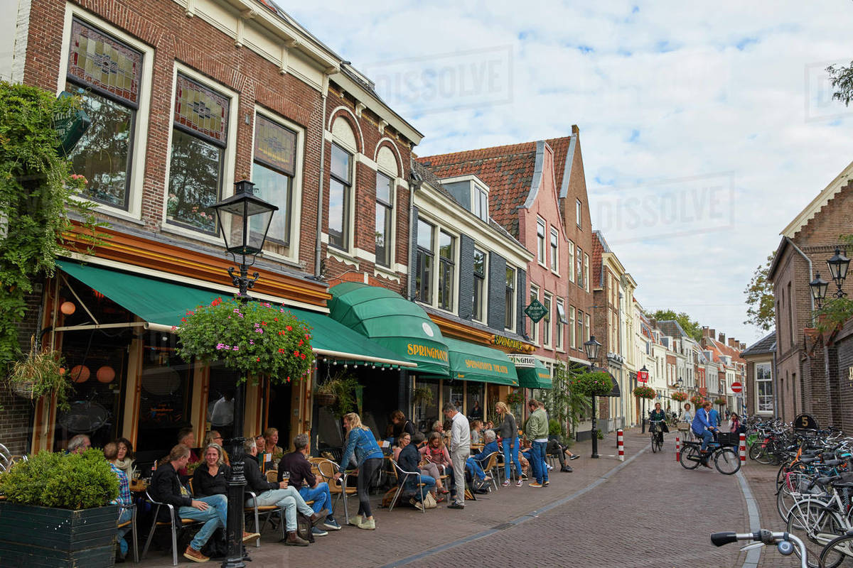 People sitting outside Springhaver Theater in Utrecht, North Holland, The Netherlands, Europe Royalty-free stock photo