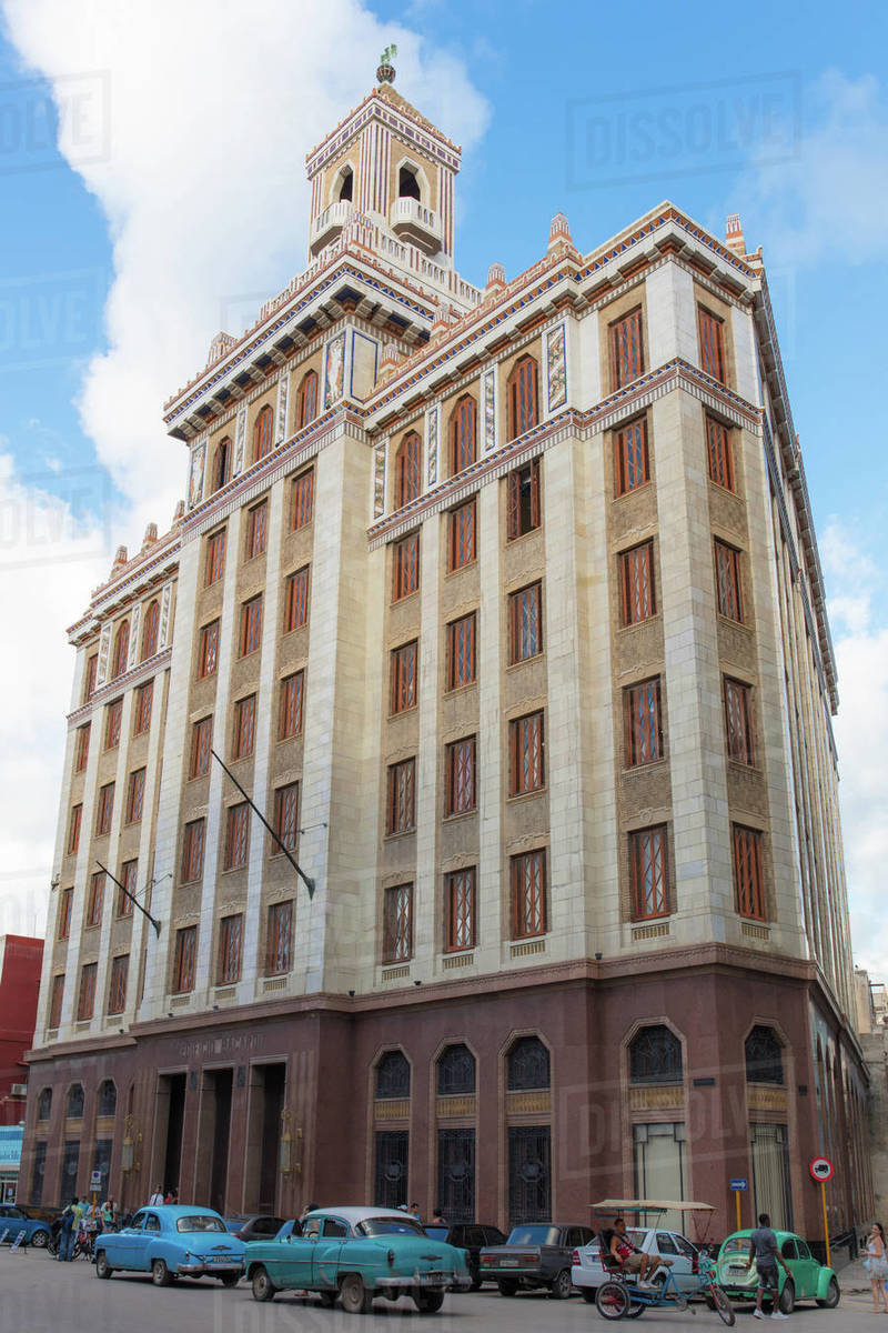 Vintage American cars outside the Bacardi building, Havana, Cuba, West Indies, Caribbean, Central America Royalty-free stock photo