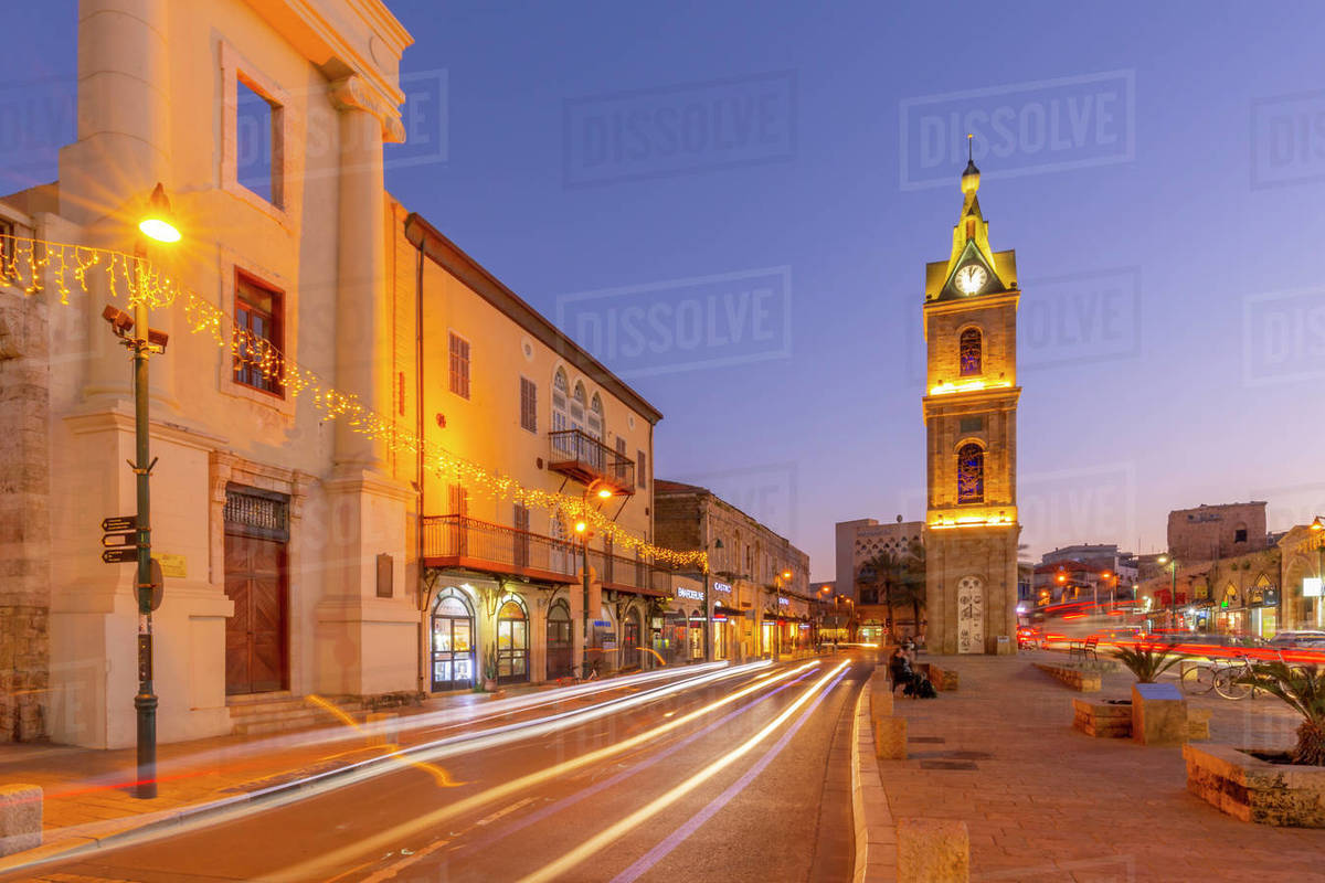 View of The Clock Tower and trail lights at dusk, Jaffa Old Town, Tel Aviv, Israel, Middle East Royalty-free stock photo