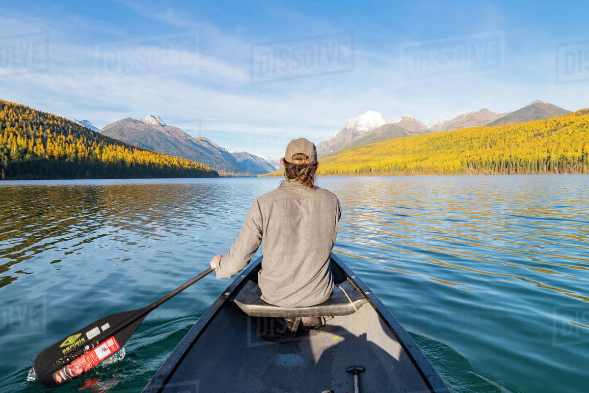 Canoeing across Bowman Lake, Glacier National Park, Montana, United States of America, North America Royalty-free stock photo