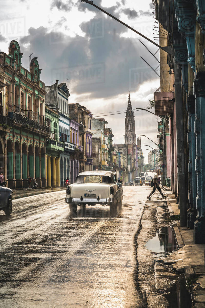 Typical street in La Habana and cathedral in the distance in rain, Havana, Cuba, West Indies, Caribbean, Central America Royalty-free stock photo