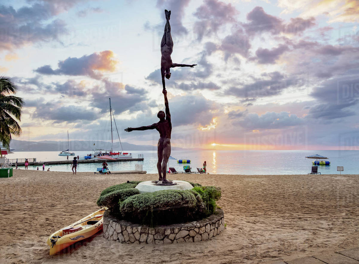Statue Balance by Basil Watson at sunset, Doctor's Cave Beach, Montego
