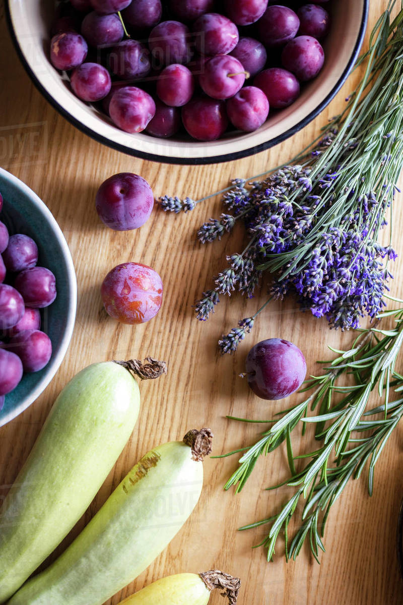 background of fruits, vegetables and herbs. plum, zucchini, lavender