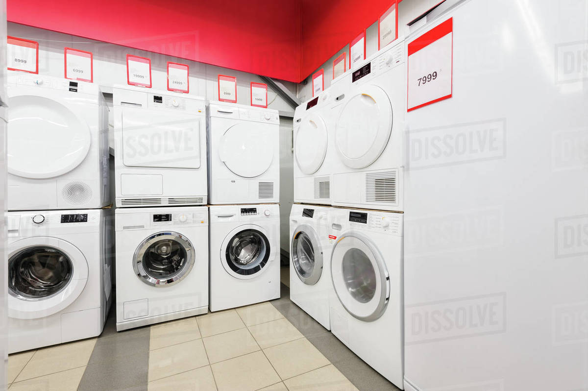 Row of washing machines in appliance store Stock Photo Dissolve