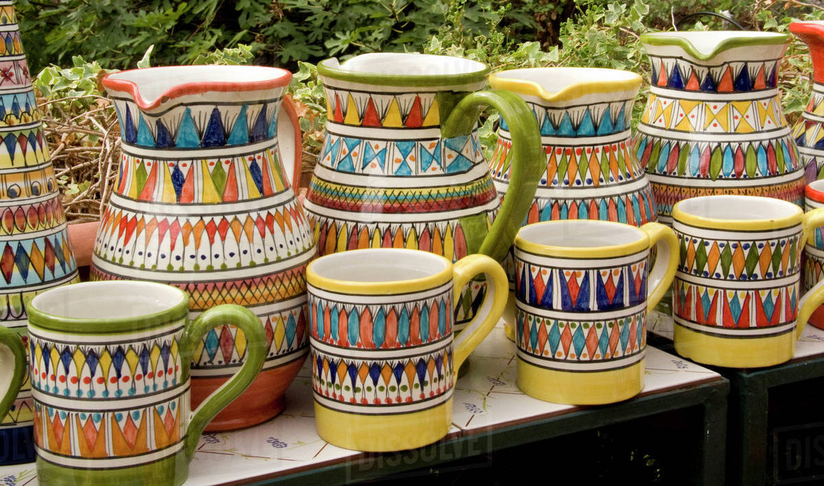 Italy, Positano. Colorful hand-painted ceramic pitchers and mugs