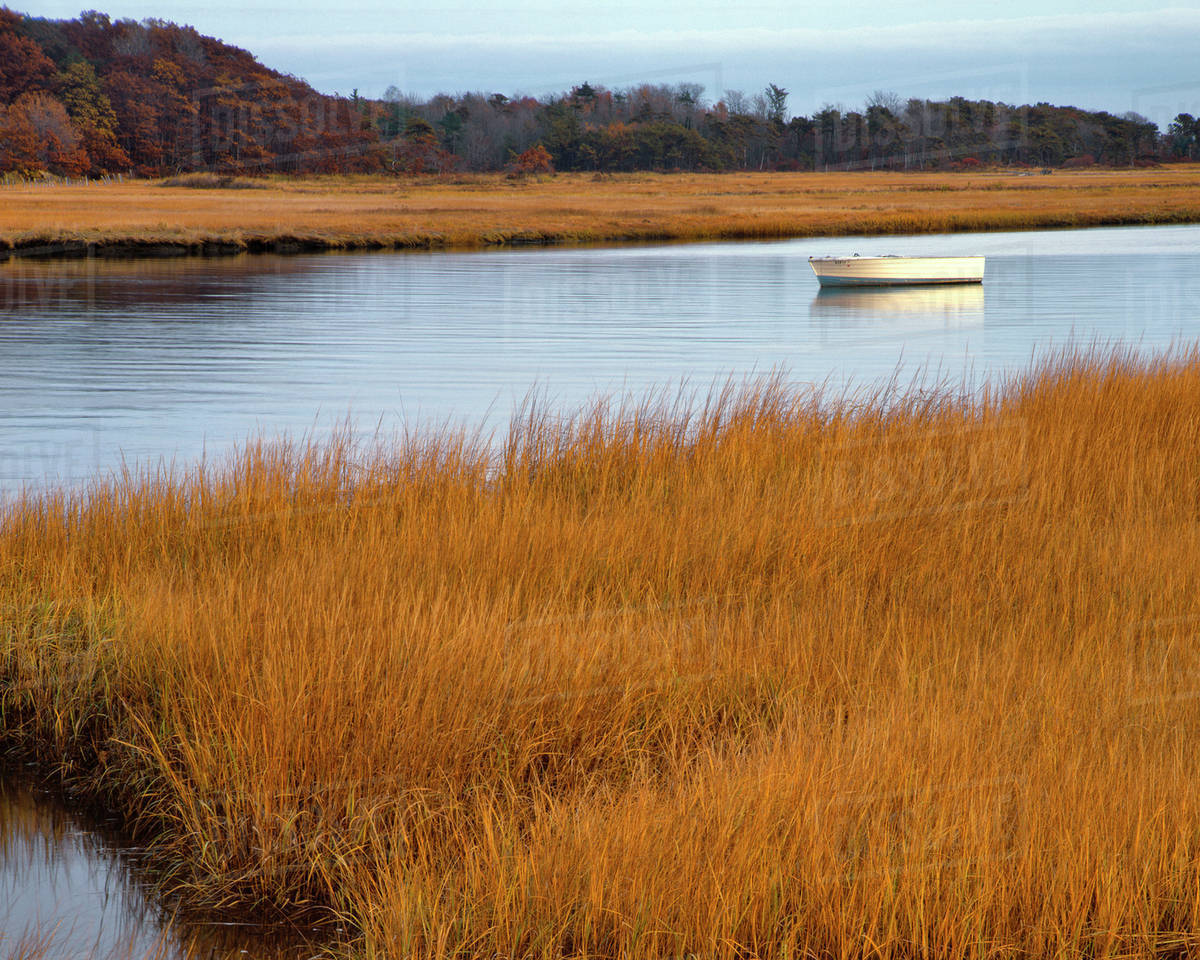 USA, Maine. Boat anchored in Mousam River. Stock Photo Dissolve