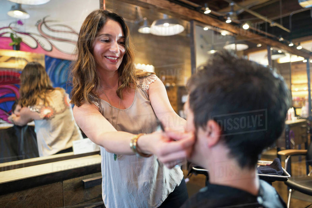 Hairstylist Working In Salon Stock Photo Dissolve