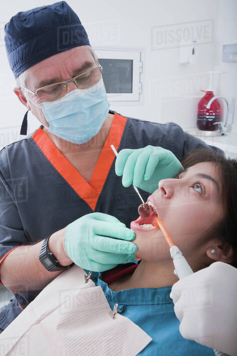 Dentist with patient - Royalty-free Stock Photo | Dissolve