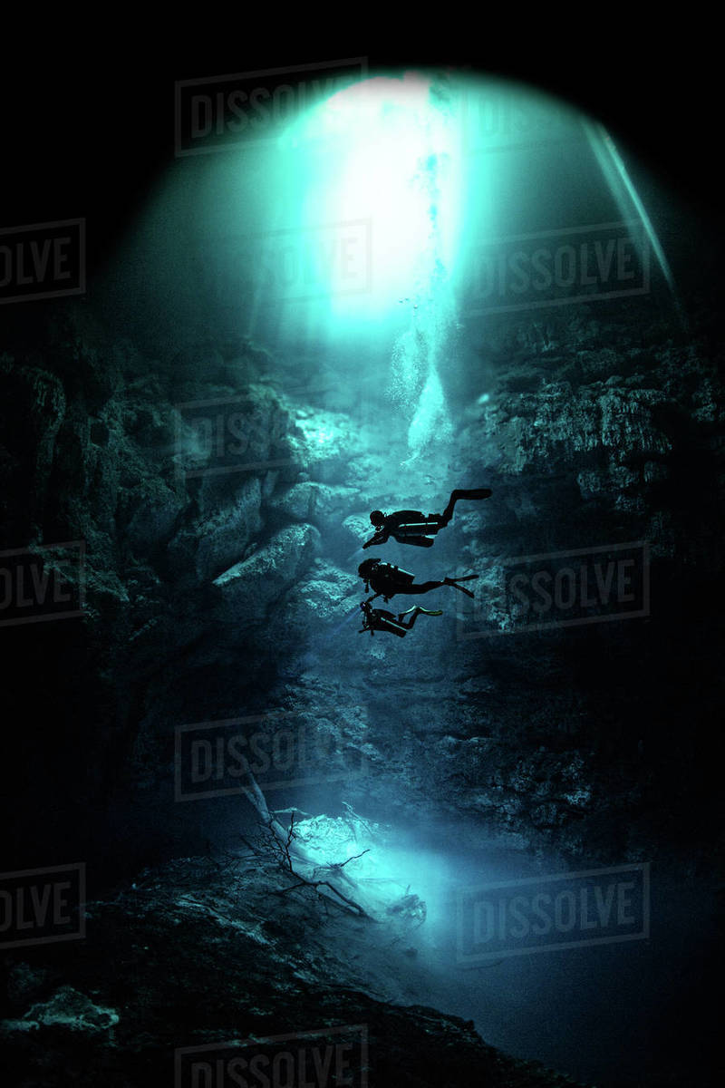 Freediver cavern diving in the pit cavern, Tulum, Quintana Roo, Mexico