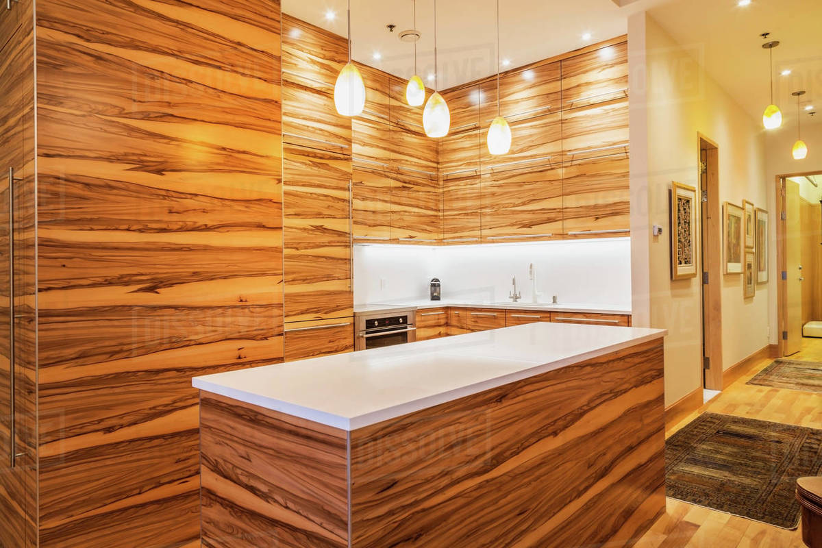 Gumwood Cabinets And Island Pure White Quartz Countertop In