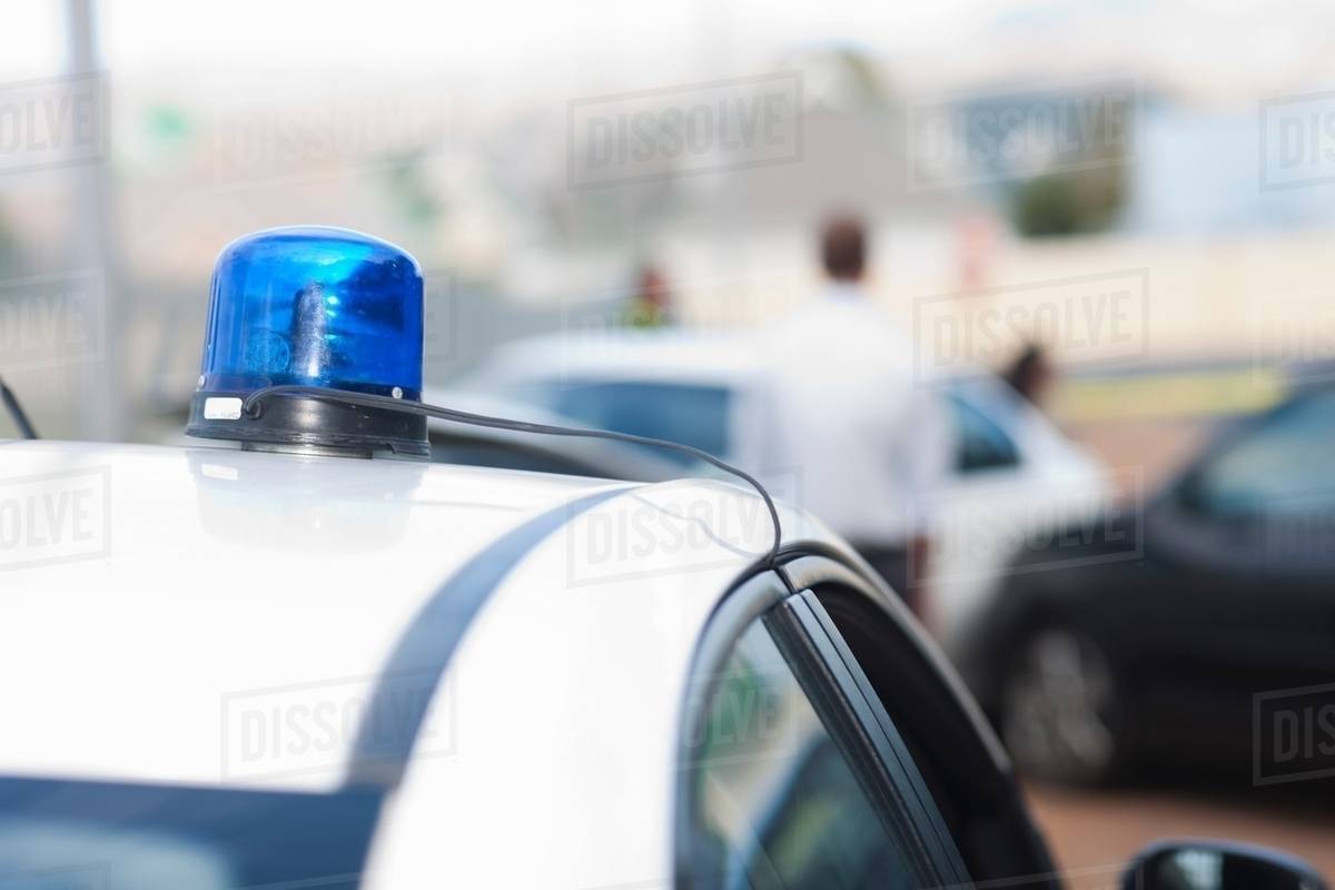 View of car accident scene from flashlights on police car Stock Photo Dissolve