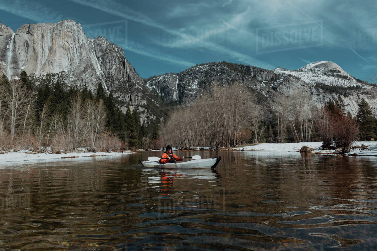 Man kayaking in lake, Yosemite Village, California, United States