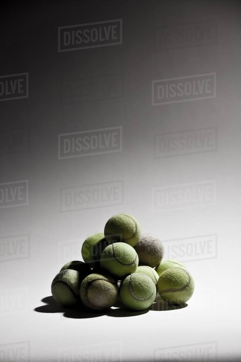 Stack of tennis balls Stock Photo Dissolve