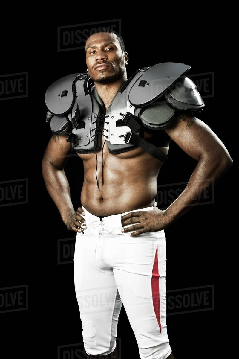 American football player wearing shoulder padding Stock Photo Dissolve