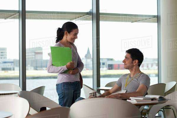Man and woman having conversation in cafe - Royalty-free Stock Photo ...