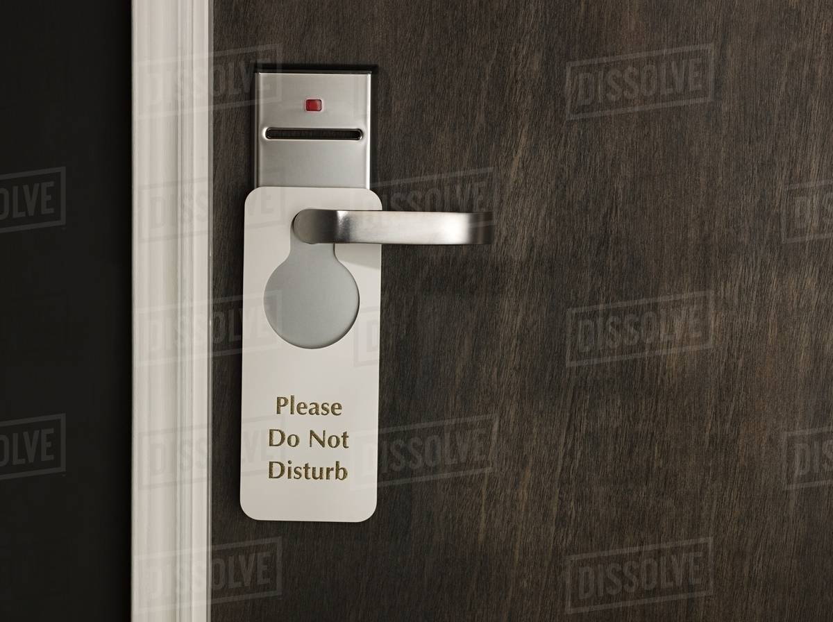 Do not disturb sign on a hotel room door Stock Photo Dissolve