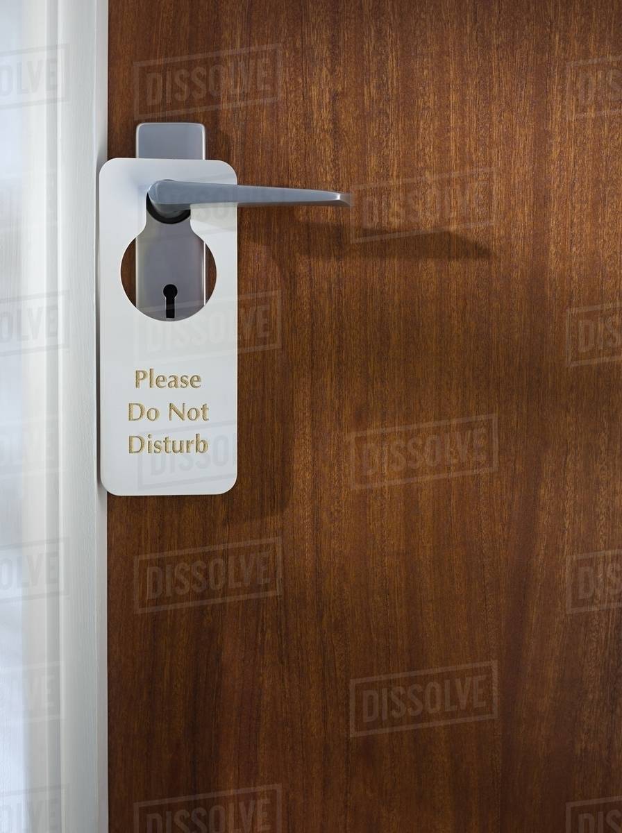 Do not disturb sign on a hotel room door Stock Photo Dissolve