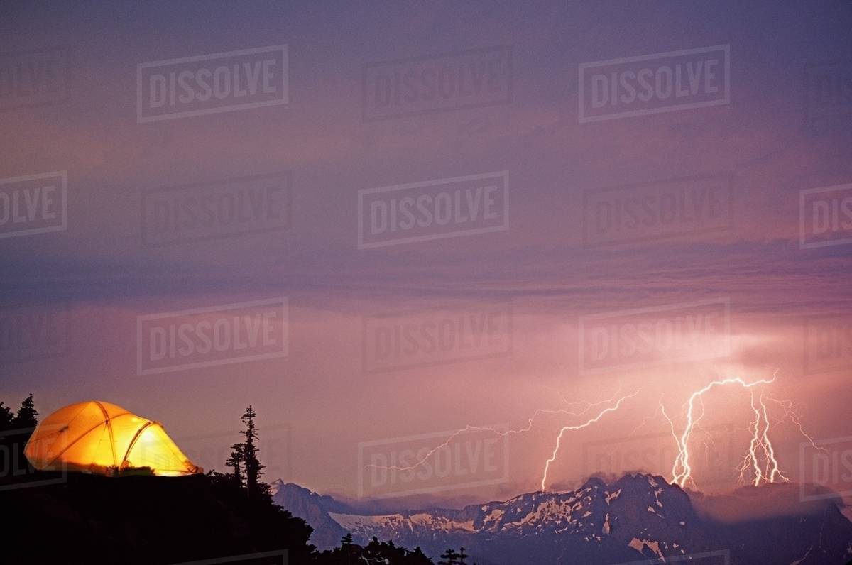 Lightning storm and tent at sloan peak Stock Photo Dissolve