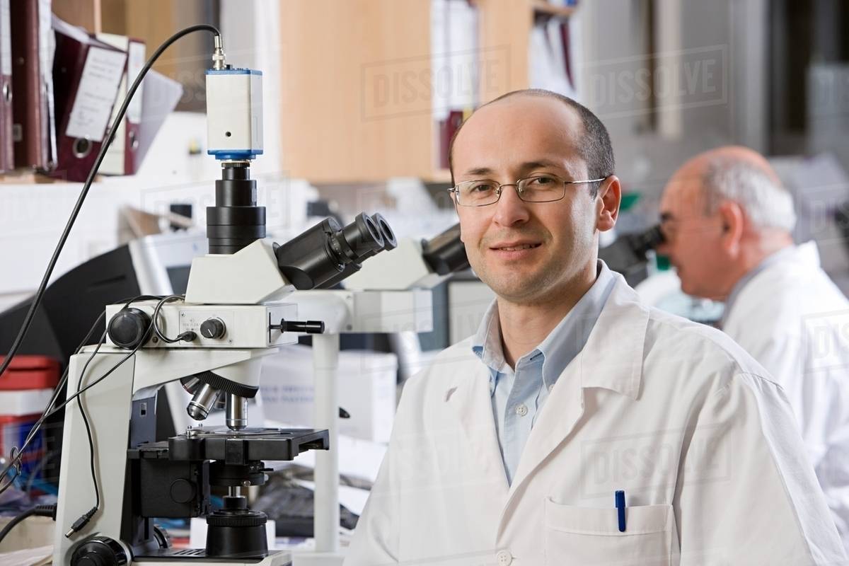 Technician in laboratory Stock Photo Dissolve