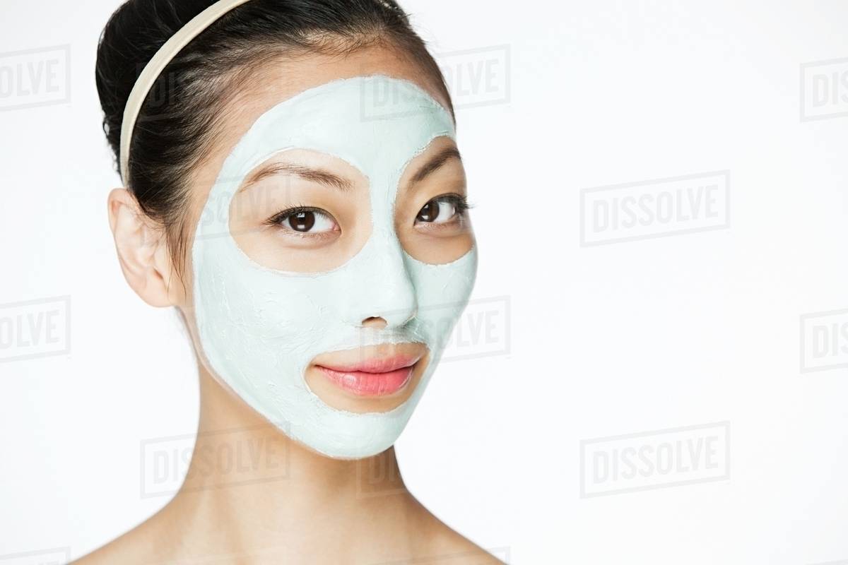 Young woman wearing face mask Stock Photo Dissolve