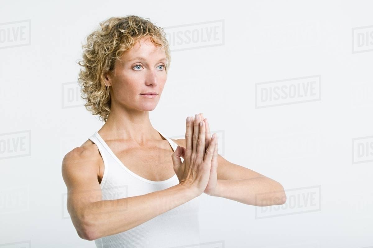 woman doing prayer pose