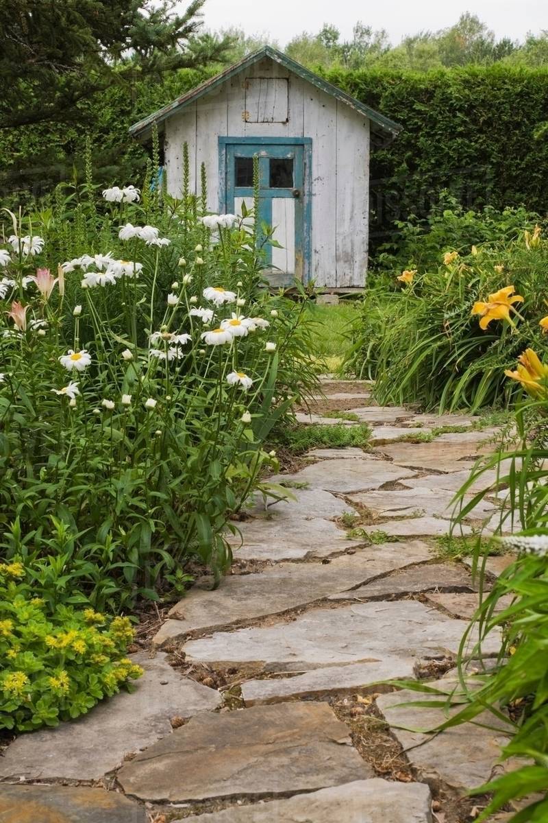 Stone paving leading to garden shed Stock Photo Dissolve