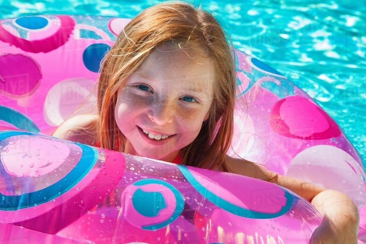 girls-in-inflatable-ring-in-swimming-pool-royalty-free-stock-photo