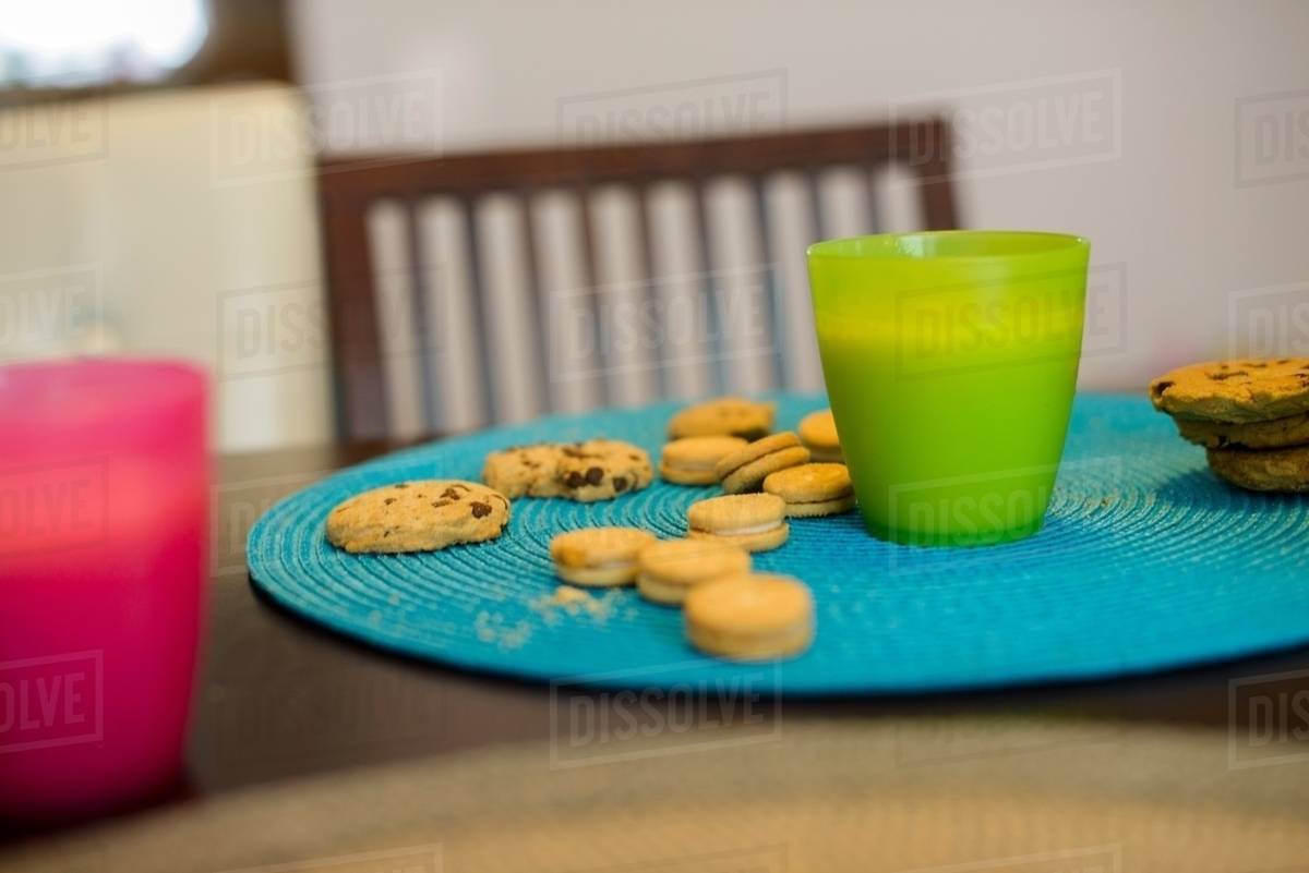 Drink and cookies on table, still life Stock Photo Dissolve