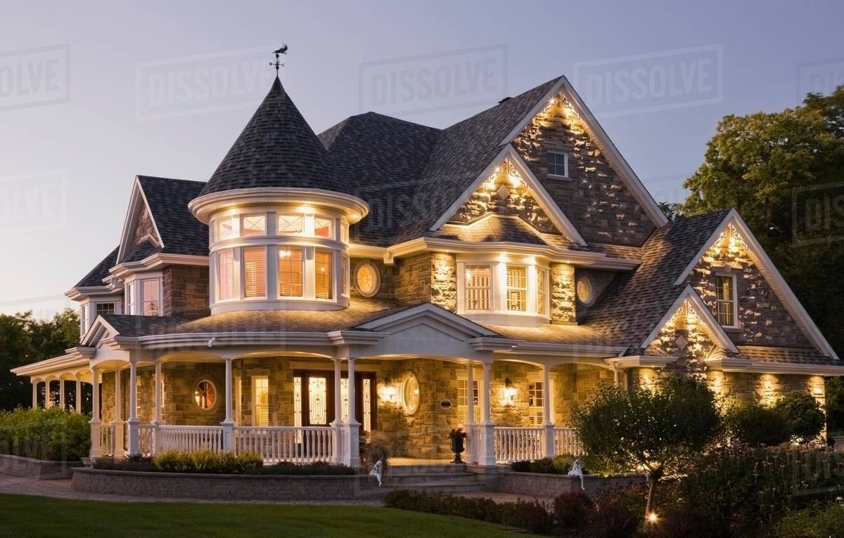 Elegant Grey Stone House With White Trim And Blue Roof At Dusk In Elegant Grey Stone House With White Trim And Blue Roof At Dusk In Summer Quebec Canada