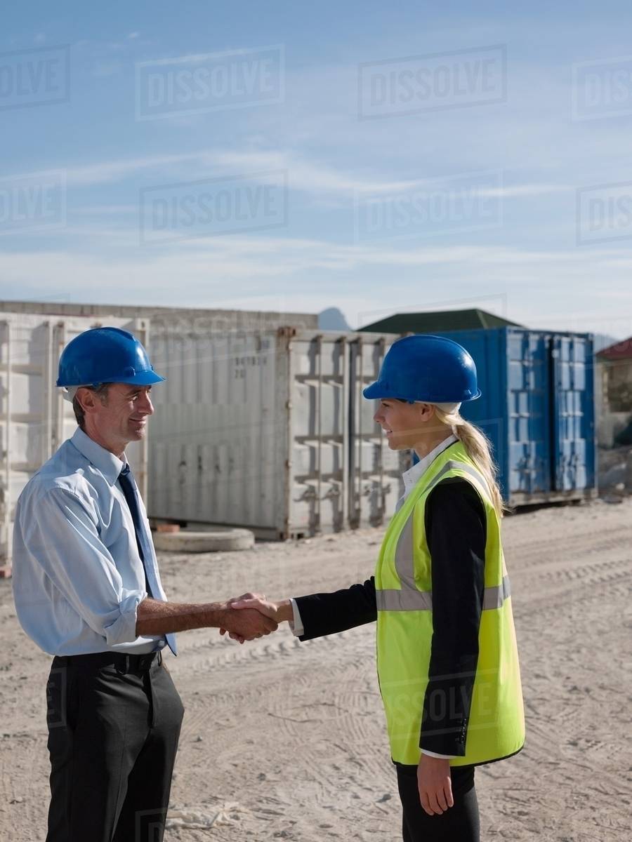 Engineers shaking hands Stock Photo Dissolve
