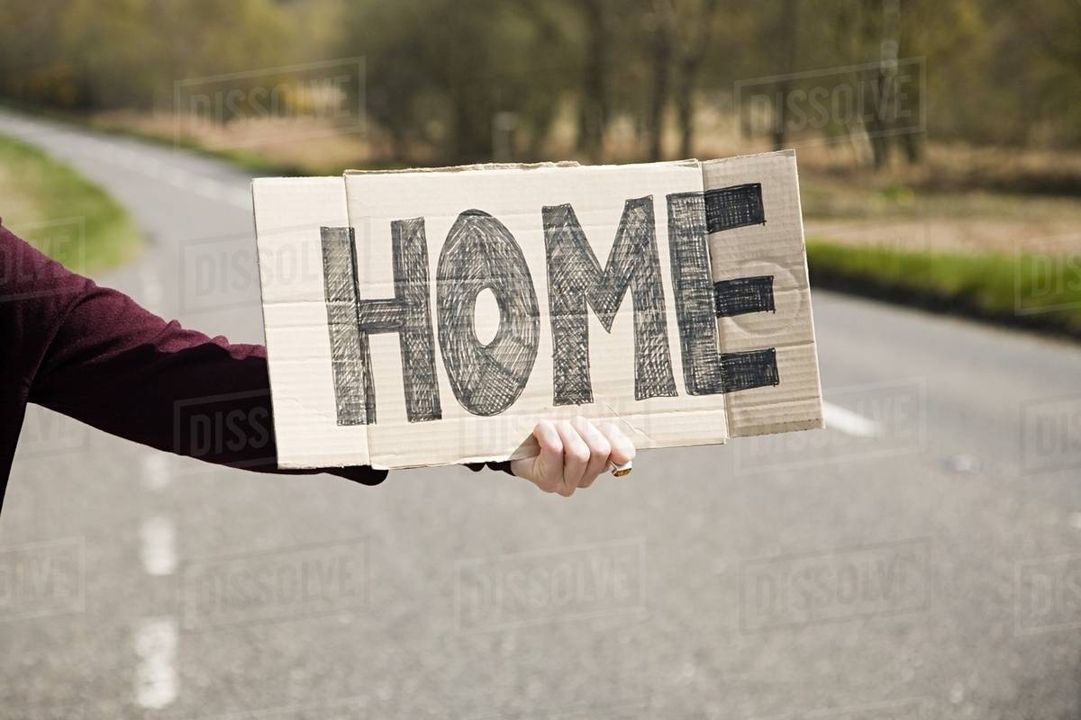 Person hitch hiking Stock Photo Dissolve