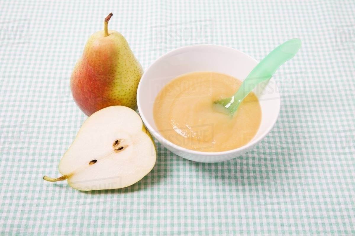 Pear and baby food Stock Photo Dissolve