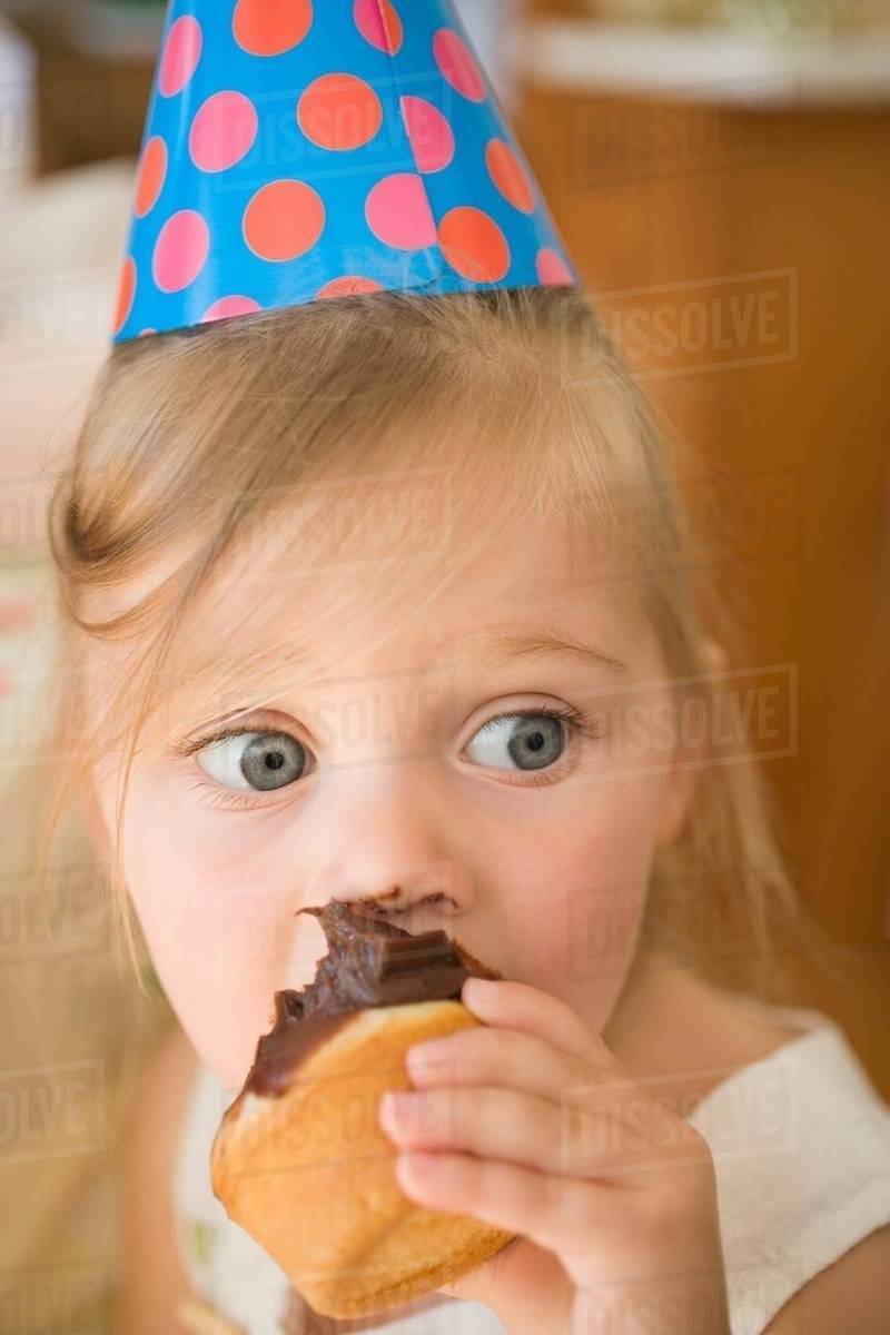 Little girl with a cupcake Stock Photo Dissolve