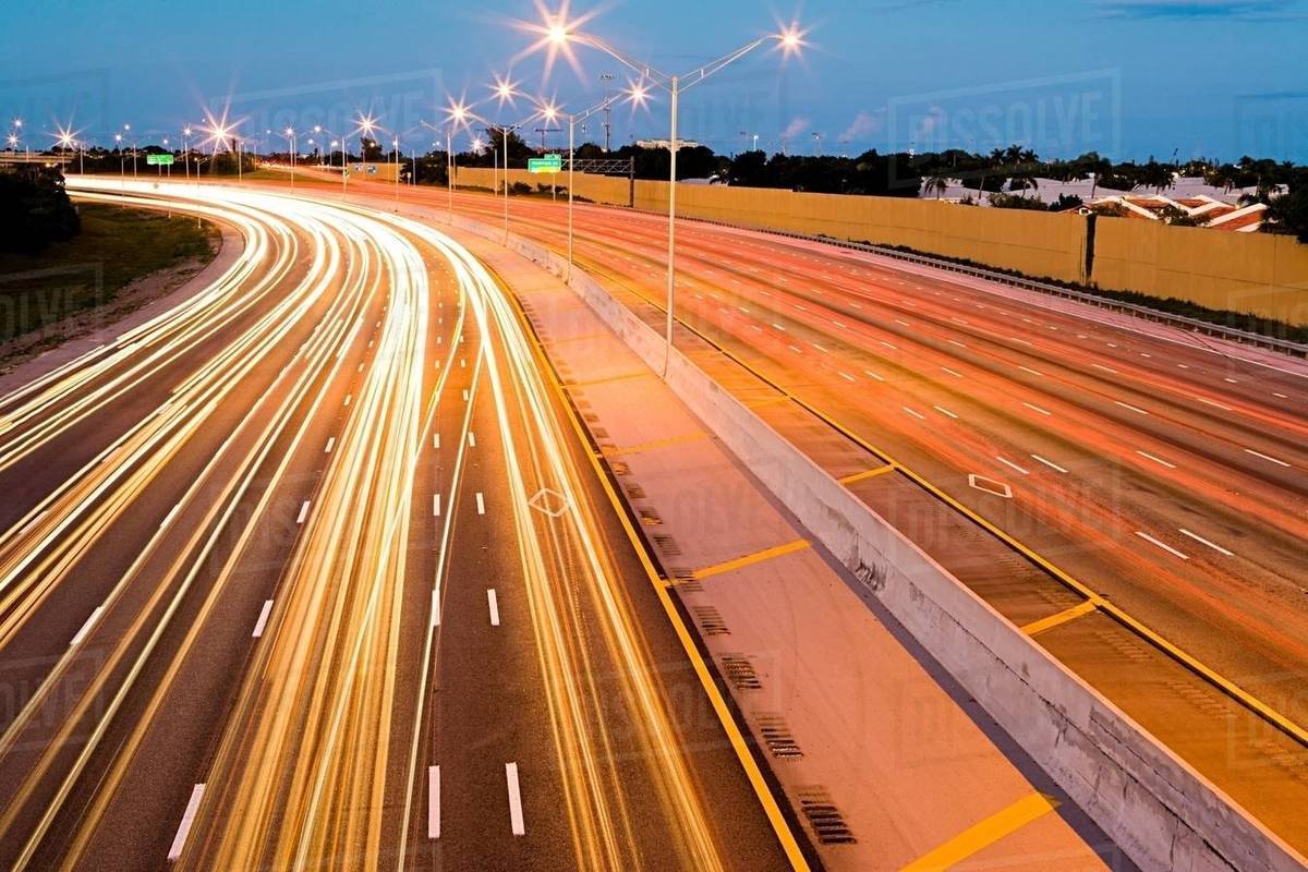 Car lights on a highway Stock Photo Dissolve