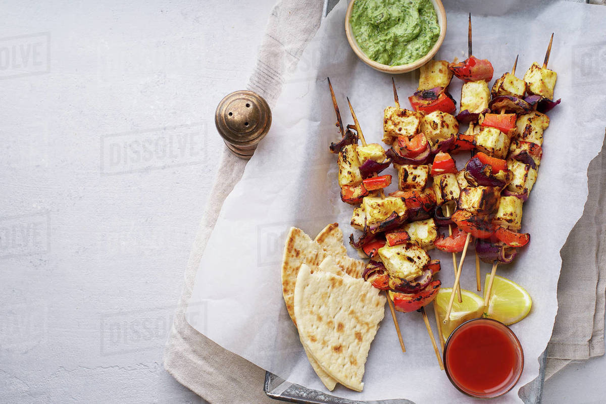 Paneer tikka starter kebabs with mint chutney and chapati. Traditional