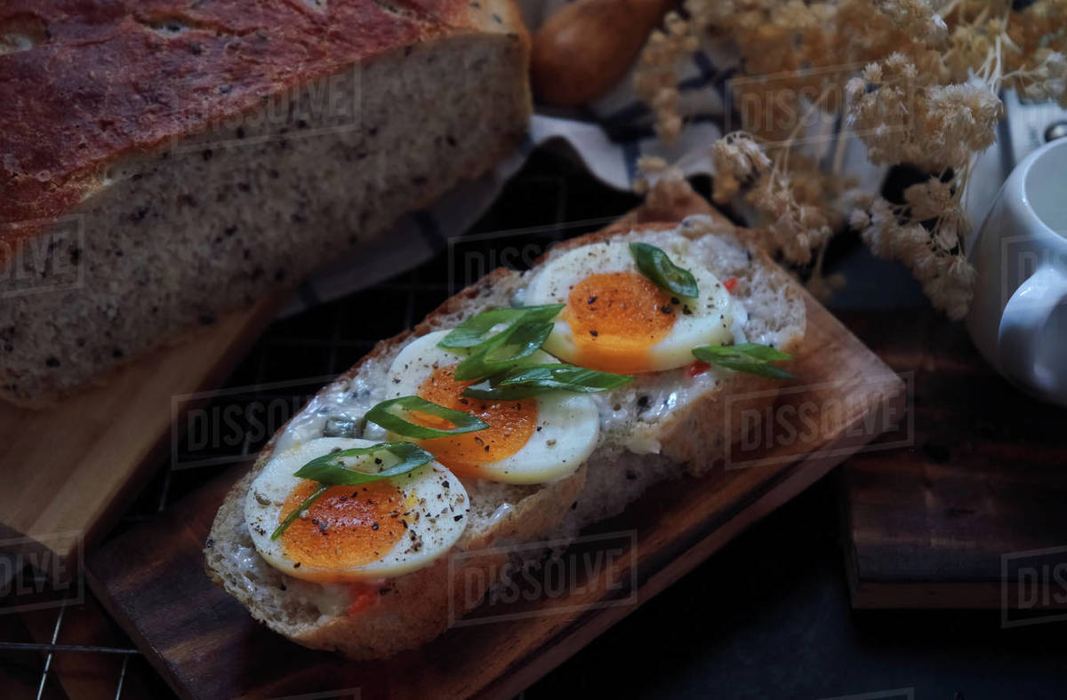Open faced sandwich sourdough bread and egg Stock Photo Dissolve