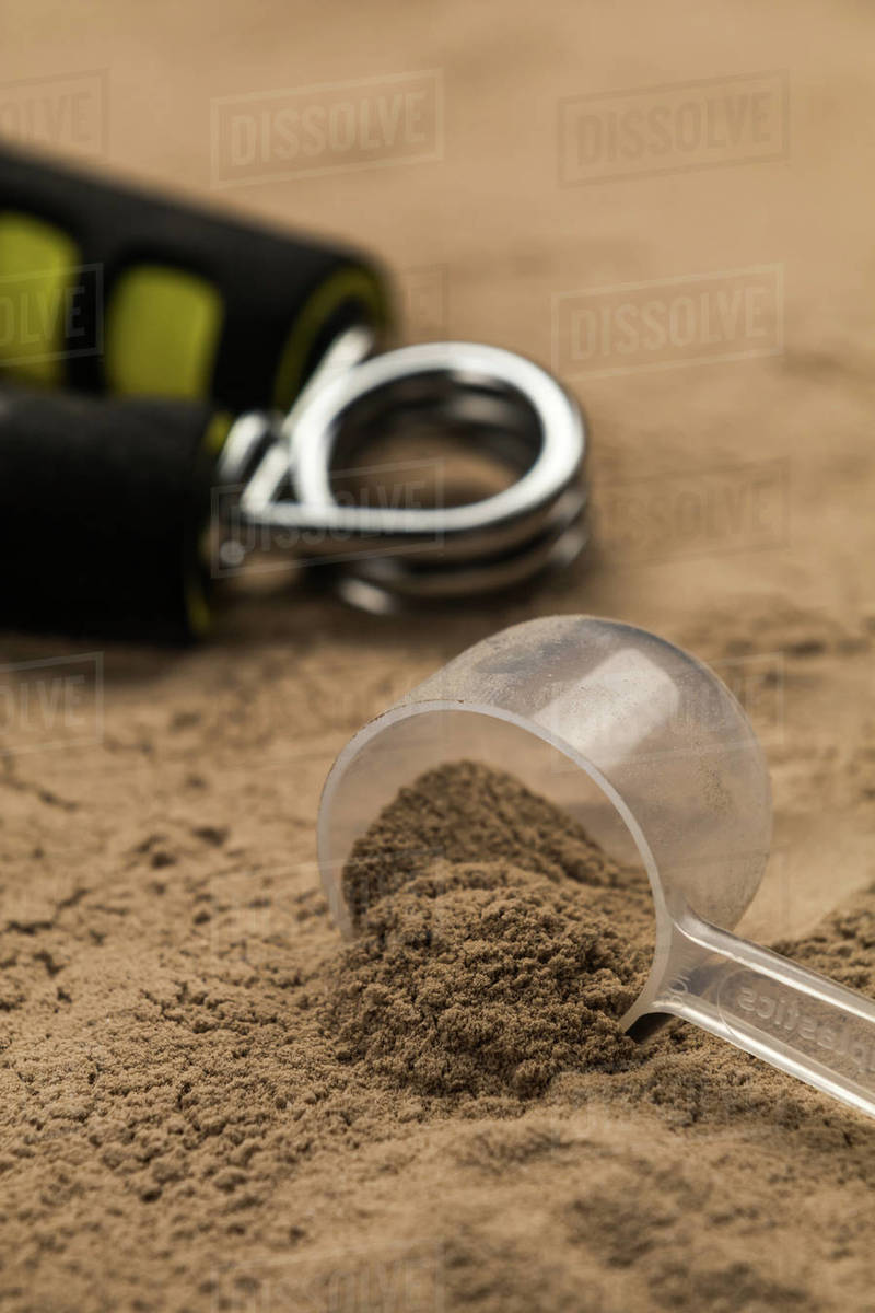 Scoops filled with protein powder Stock Photo Dissolve