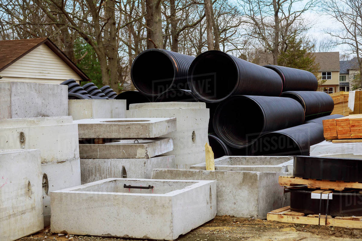 PVC tubes plastic pipes stacked in rows at a construction site on reconstruction of the city