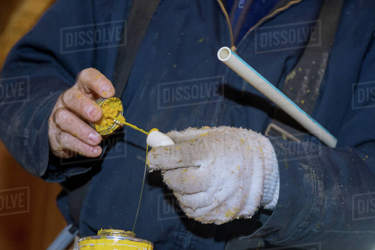 Prepare a pipe joint with glue sealing water line PVC pipes on new home