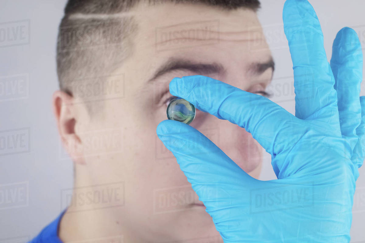 Conceptual shot of an eye crystalline lens replacement. Ophthalmic surgery. Return of sight