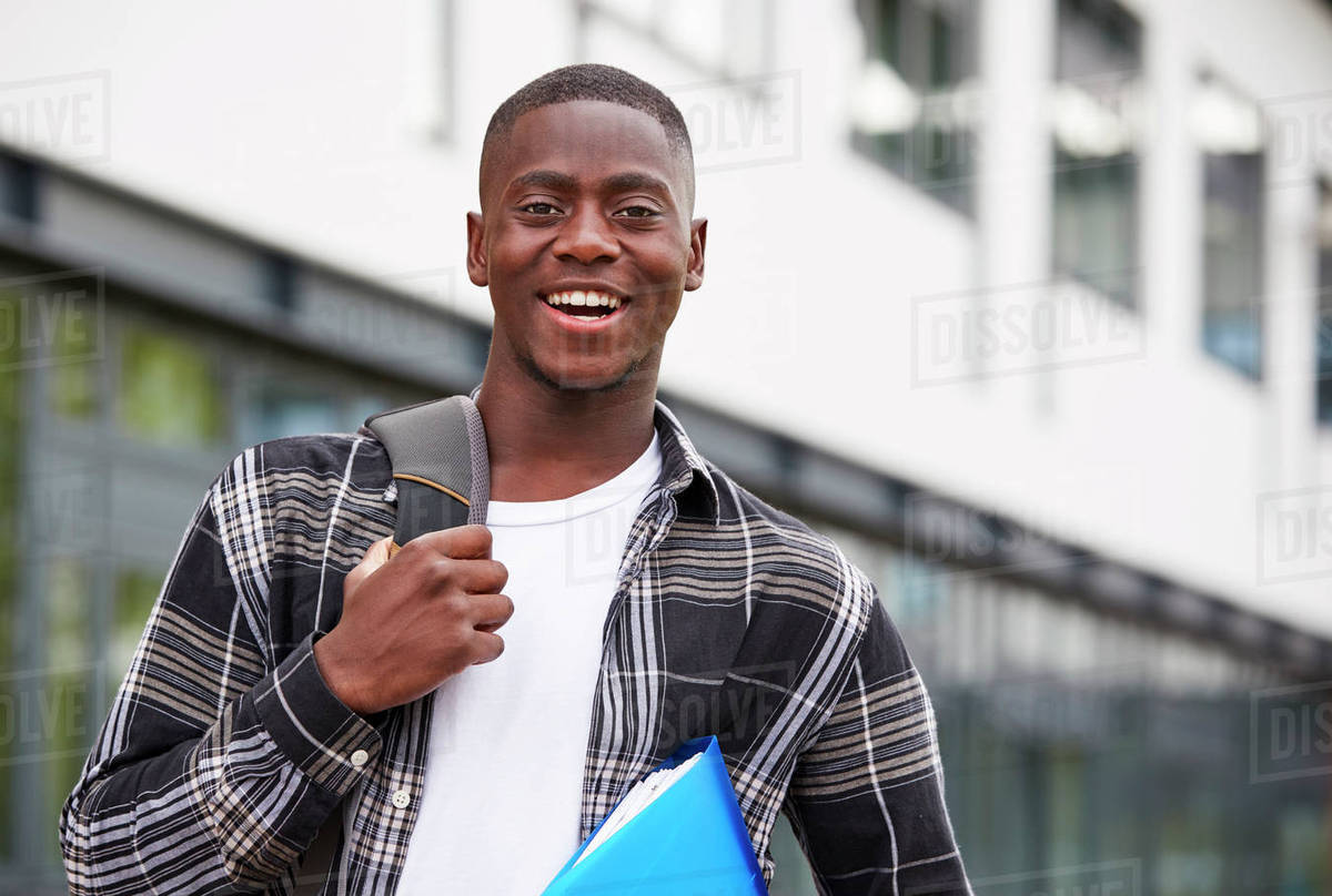 Portrait Of Male Student Standing Outside College Building Stock 